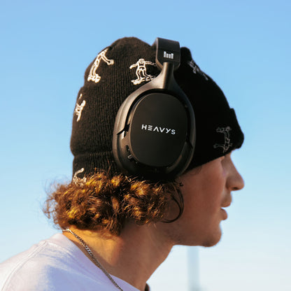 man wearing heavysheadphones outdoors 